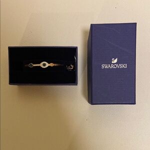 SWAROVSKI EVIL EYE Blue and Gold Bracelet.